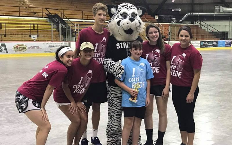 Group of volunteers with mascot