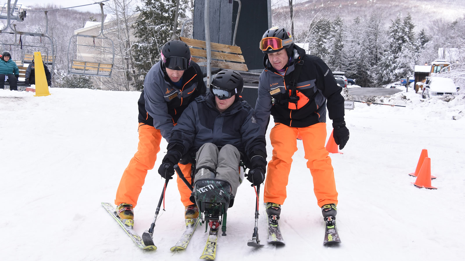 Skiier getting off chairlift